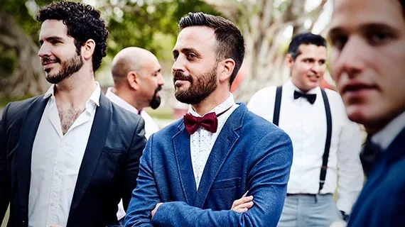 A group of men dressed up for a fancy event.