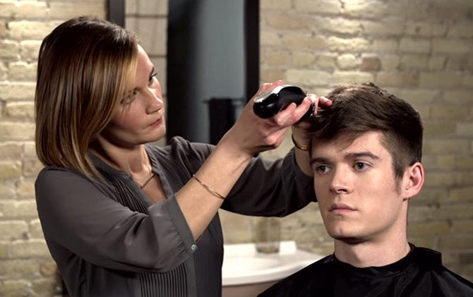 A man getting a haircut with Wahl hair clippers.