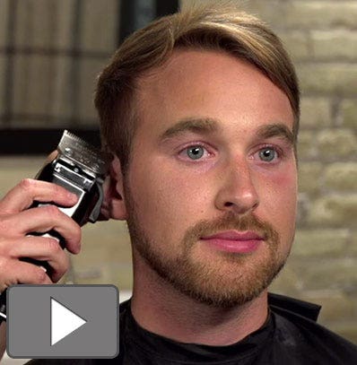 A man getting his hair cut on the side of his head with a Wahl hair clipper.