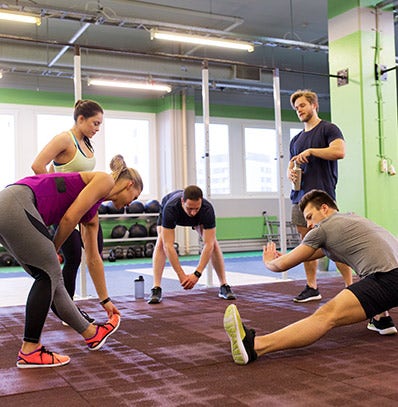 A group of people stretching together. 