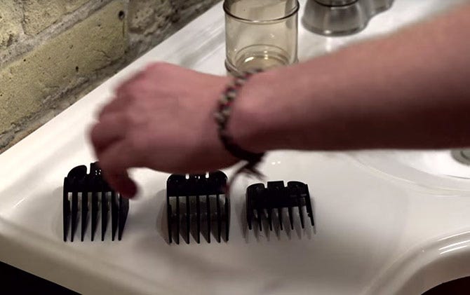 Selecting the right guide combs to give yourself a haircut.