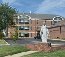 St. Mary’s School building and statue